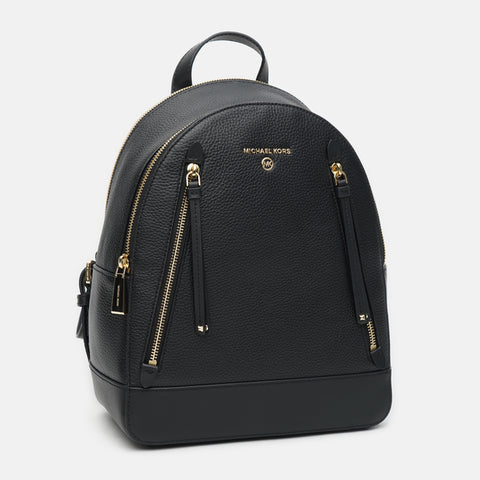 Black backpack with gold zippers on a white background