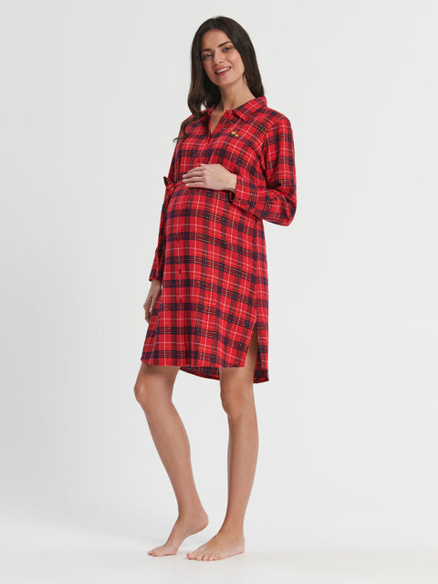 Woman wearing a red plaid dress on a white background