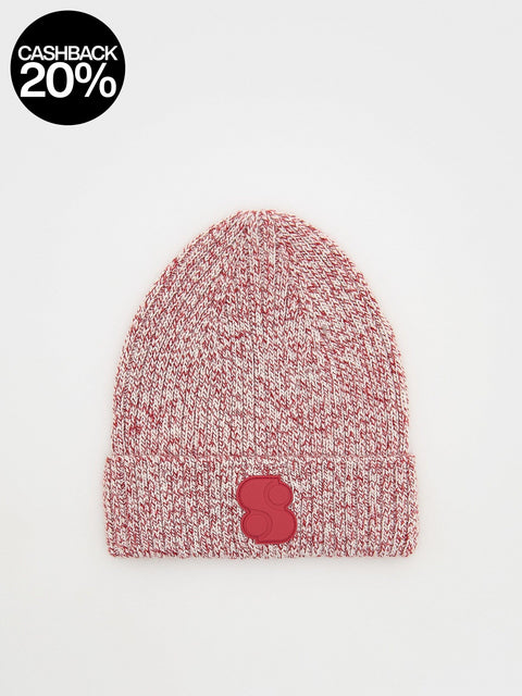 Pink knit beanie with a red logo on a light gray background