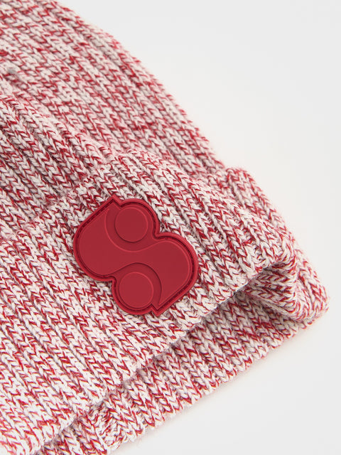 Red and white checkered fabric with a red paw print design on a white background