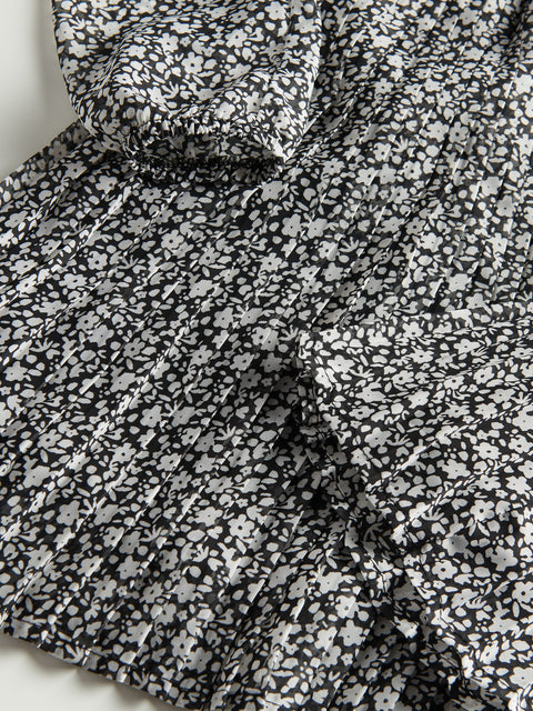Close-up of black and white floral fabric on a white background