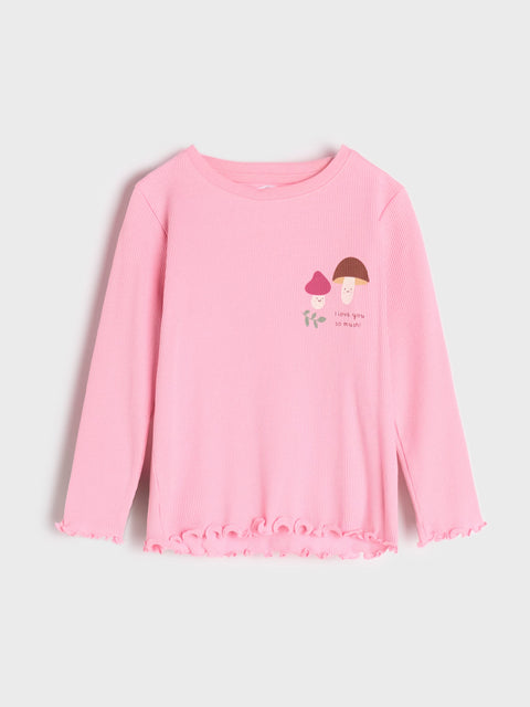 Pink long-sleeve shirt with a graphic on a light gray background