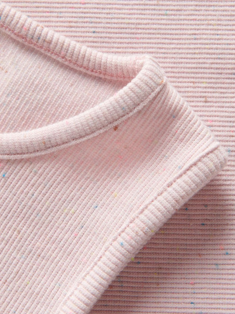 Close-up of pink ribbed fabric with a textured pattern