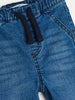 Close-up of blue denim shorts with drawstring on a white background