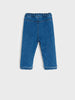 Blue denim pants on a white background