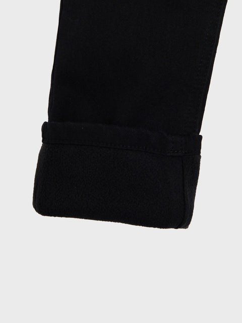 Close-up of a black fabric edge on a white background