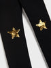 Black tie with gold star designs on a white background