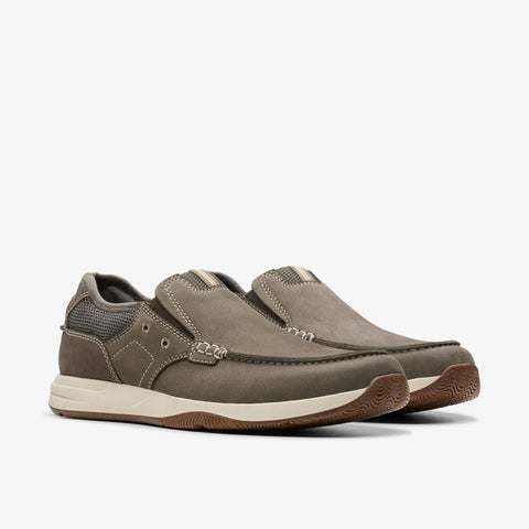 Pair of brown slip-on shoes on a white background