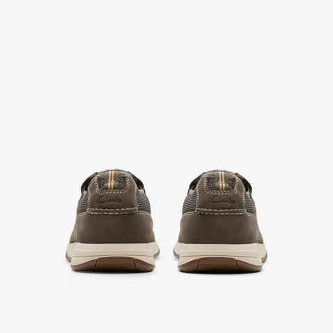 Brown sneakers with white soles on a white background