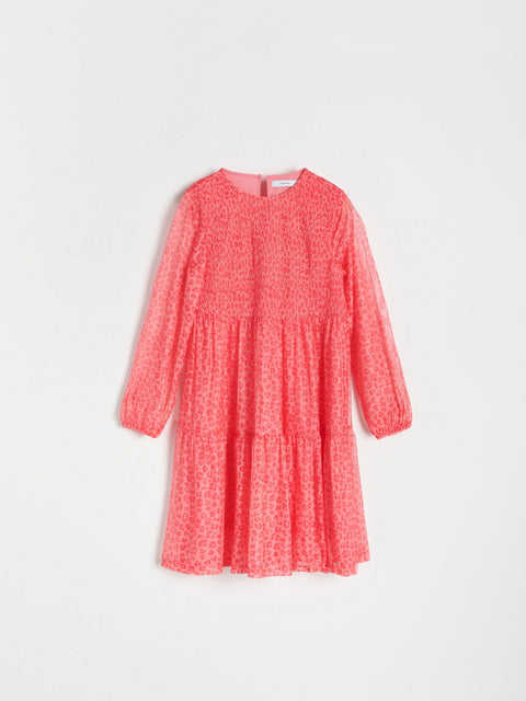 Red dress with a subtle pattern on a white background