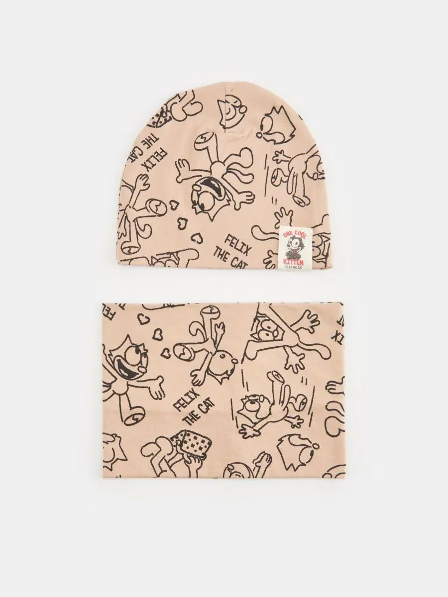 A beige baby beanie and matching neck gaiter set featuring a black line art cartoon cat pattern with the text 'FEEL THE CAT'.
