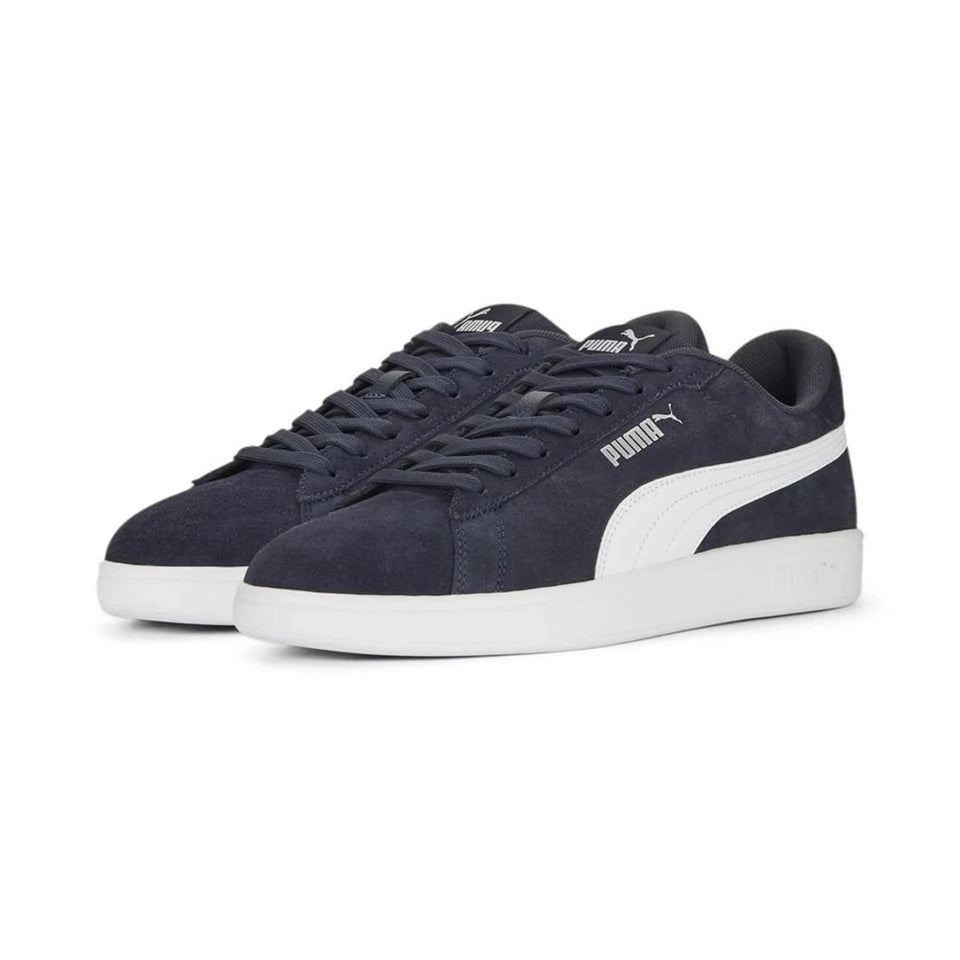 Black sneakers with a white lightning bolt design on a light gray background