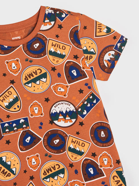 Orange t-shirt with camping-themed graphics on a white background
