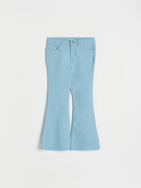 Light blue flared pants on a white background