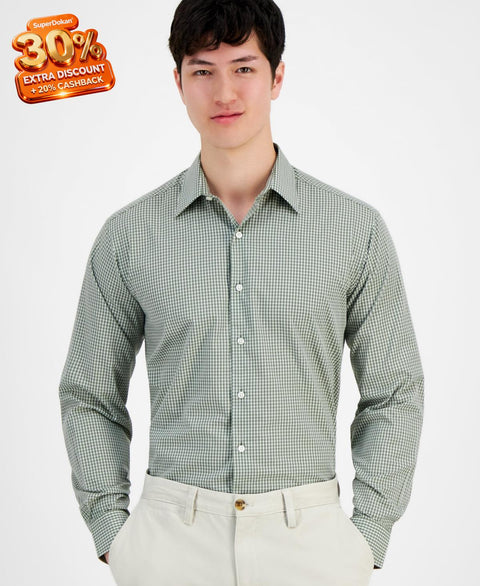 Man wearing a green checkered shirt against a white background