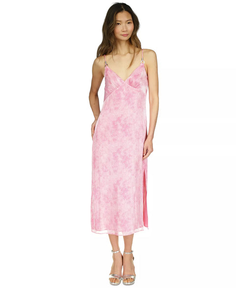 Woman wearing a pink floral dress on a white background