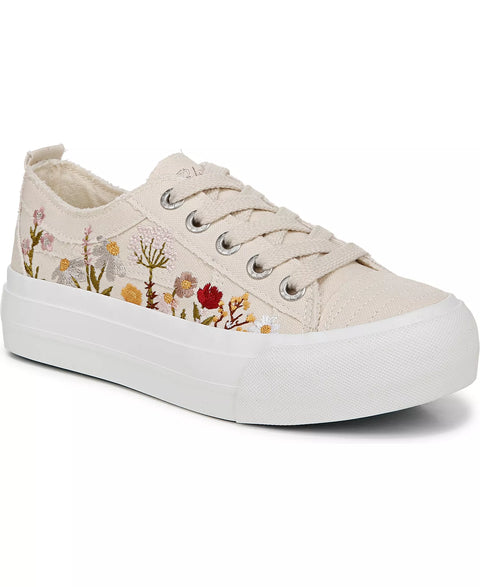 Beige sneaker with floral patterns on a white background