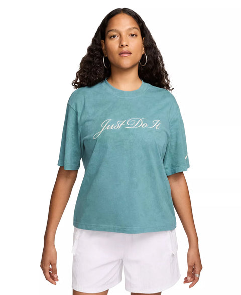 Woman wearing a teal t-shirt with 'Just Do It' text on a white background