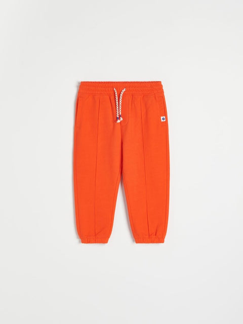 Orange sweatpants on a white background