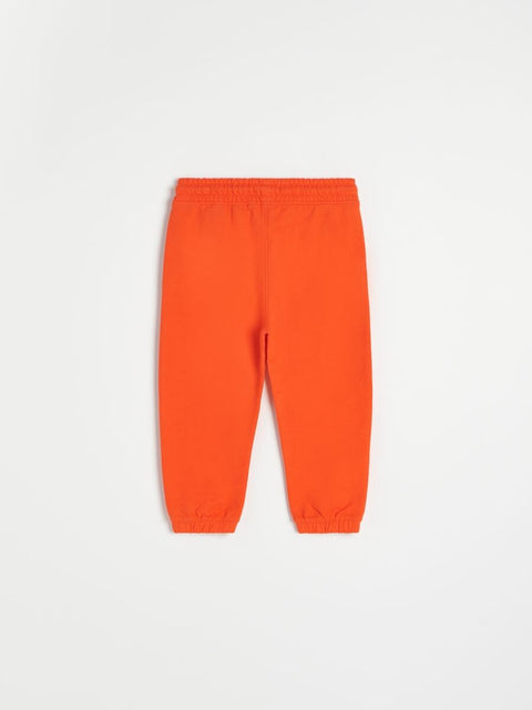Orange sweatpants on a white background