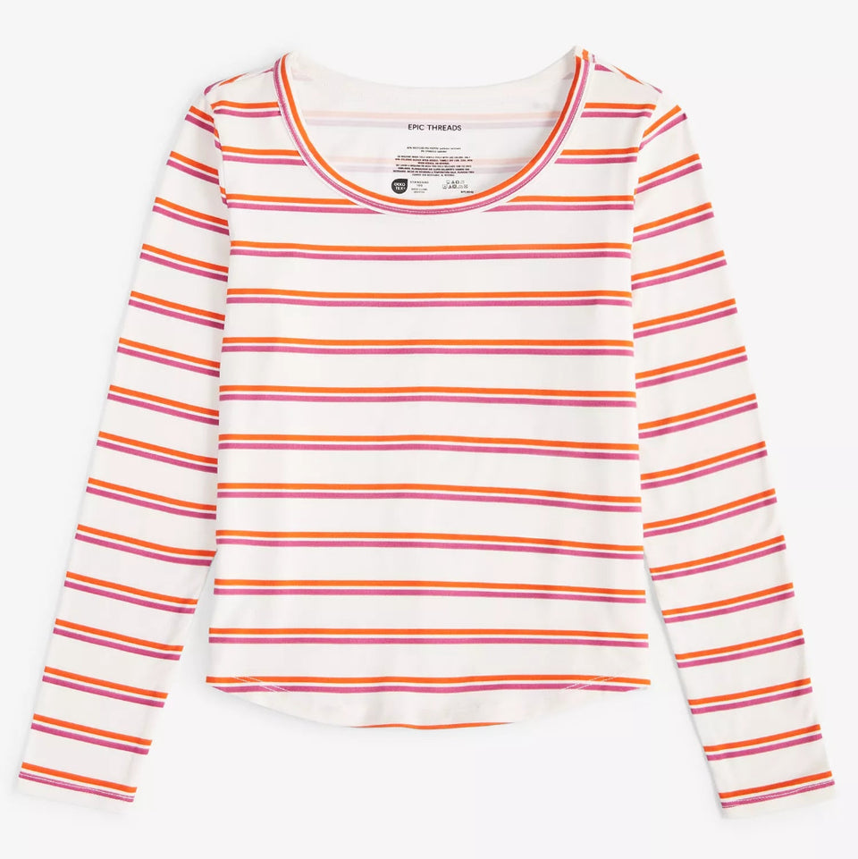 A long-sleeve scoop-neck top by Paige Thiermann featuring horizontal stripes in orange, pink, and yellow on a white base, displayed flat against a light gray background.