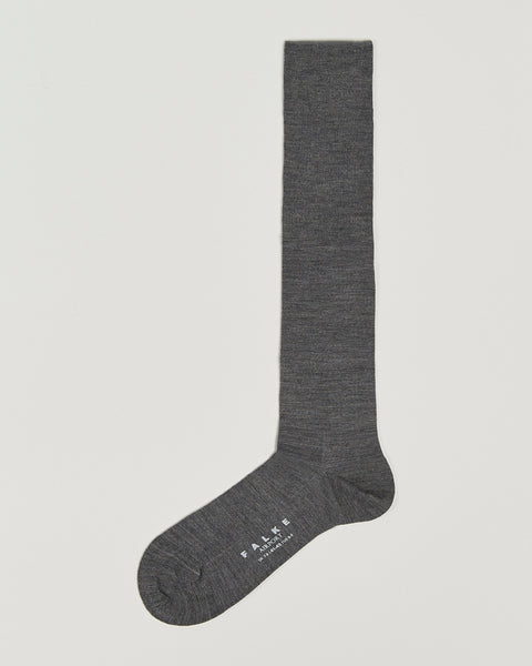 Gray knee-high sock on a light gray background