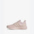 A single Adidas sneaker in a light pastel pink color, shown from a side profile view against a clean white background.
