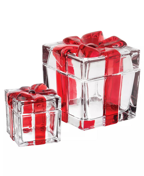 Two clear glass gift boxes with red ribbons on a white background