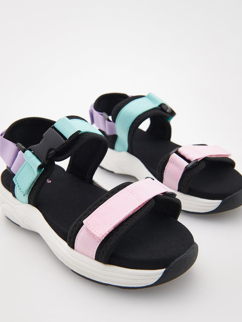 Black sandals with colorful straps on a white background