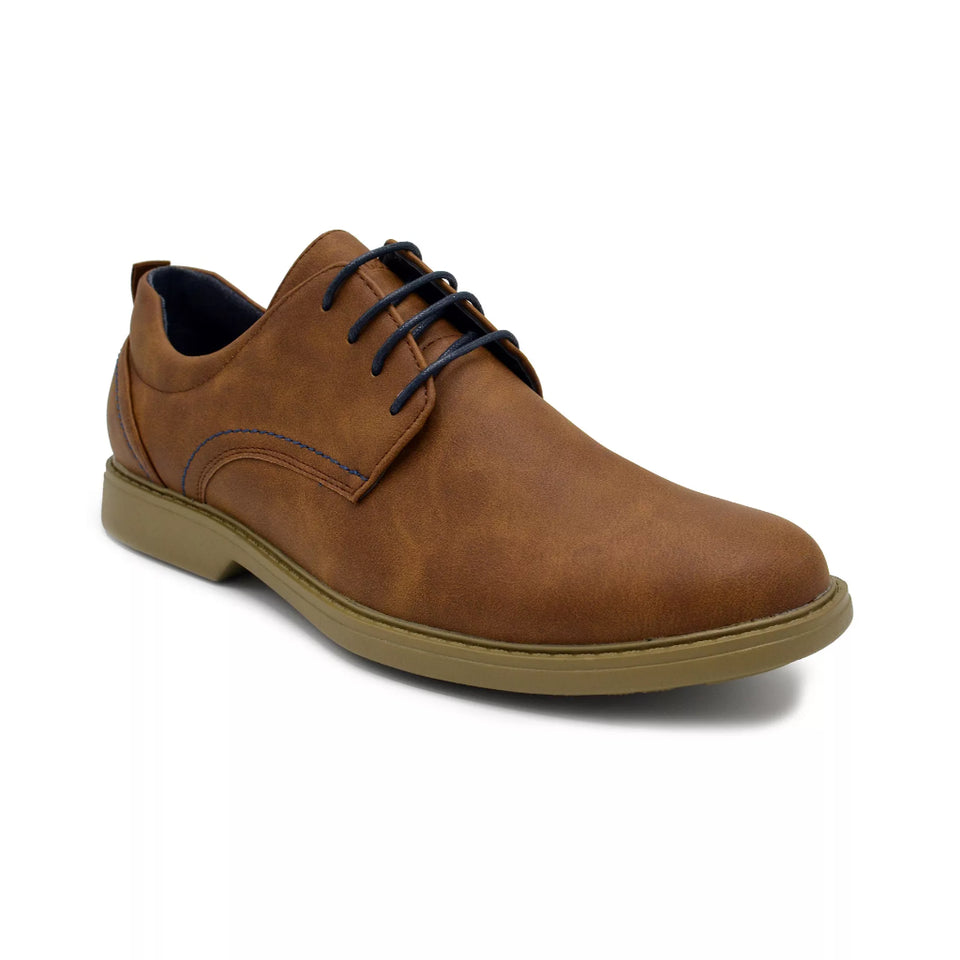A brown leather lace-up dress shoe with dark navy laces, a tan outsole, and a blue interior lining, shown from a three-quarters angle on a white background.