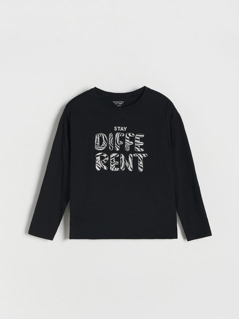 Black long-sleeve shirt with 'Stay Different' text on a light gray background