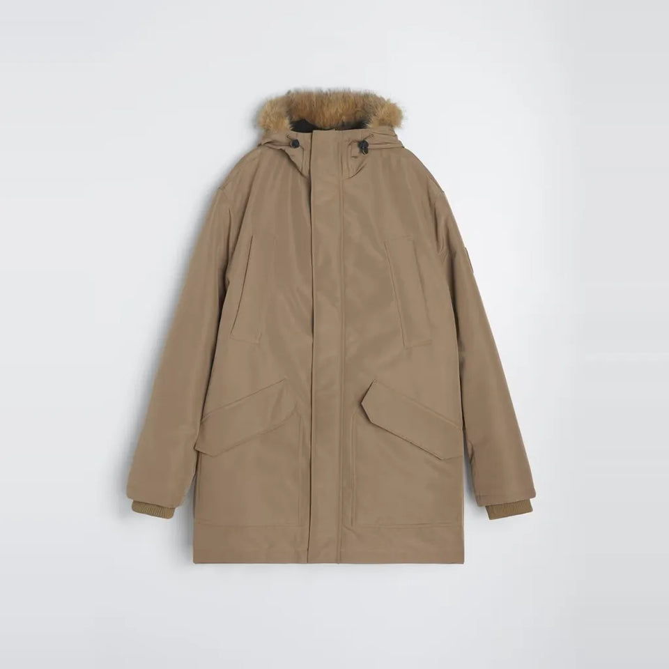 A mid-length parka jacket in a warm camel brown color, featuring a faux-fur trimmed hood and two large front flap pockets, shown against a plain light gray background.