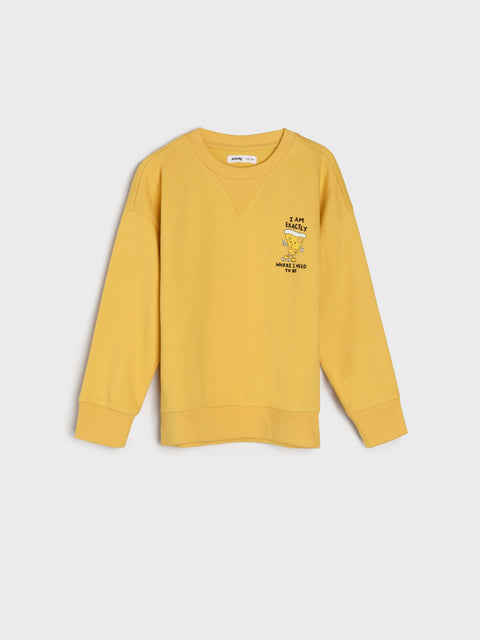 Yellow sweatshirt with a graphic on a light gray background
