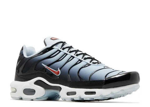 Nike sneaker with black, white, and blue design on a white background