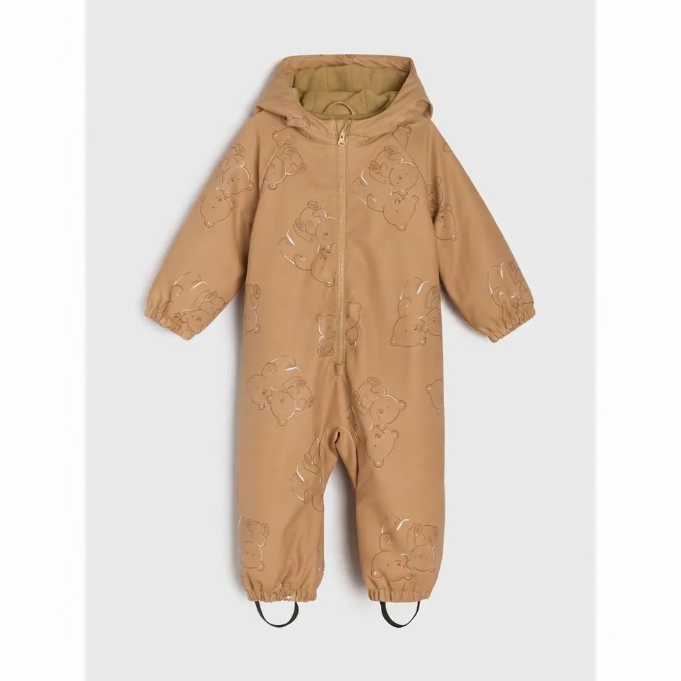 A tan hooded one-piece snowsuit with an all-over tonal teddy bear applique pattern, shown flat against a light gray background.