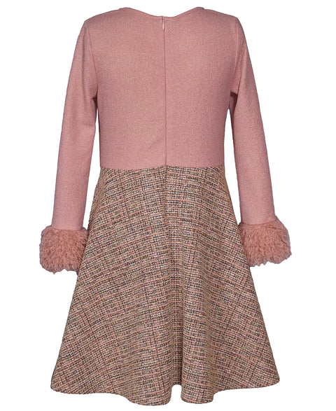 Pink top and tweed skirt set on a white background