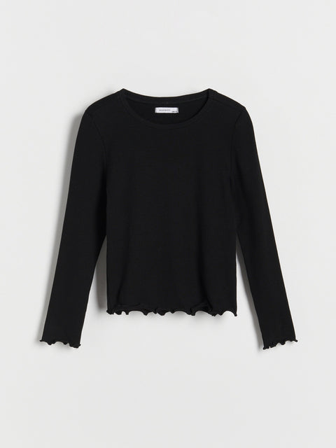 Black long-sleeve top on a light gray background