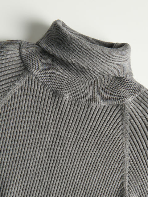 Close-up of a gray ribbed knit sweater with a high collar on a light background