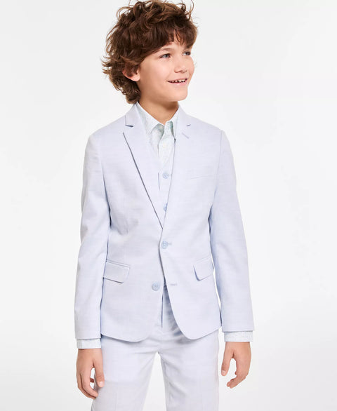 Young boy wearing a light blue suit on a white background