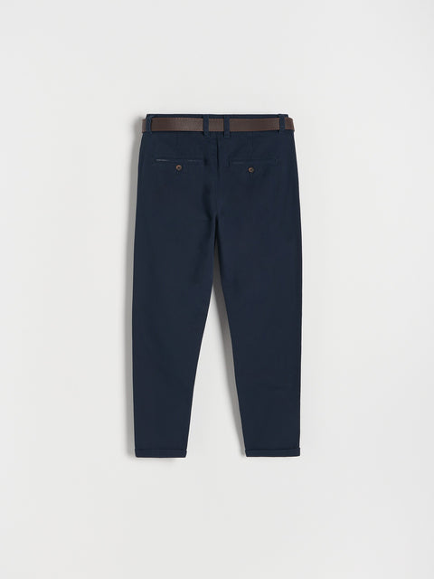 Navy blue pants with a brown belt on a white background