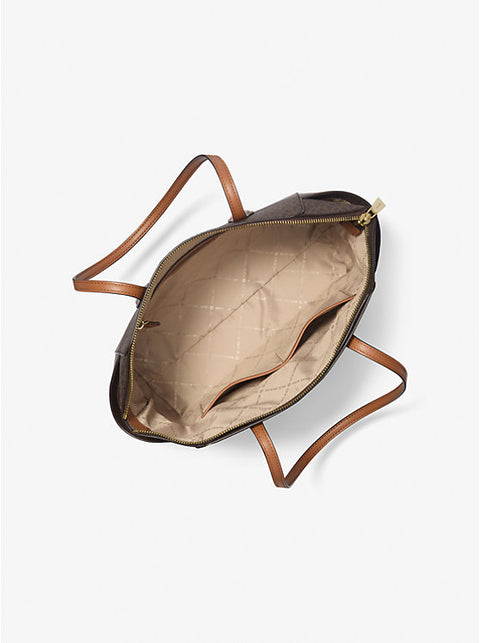 Open handbag with brown leather handle and beige interior on a white background