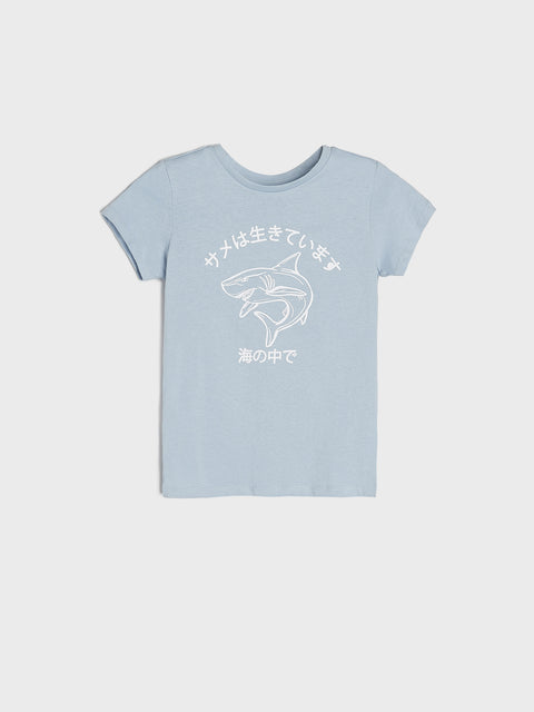 Light blue t-shirt with white shark graphic and text on a white background