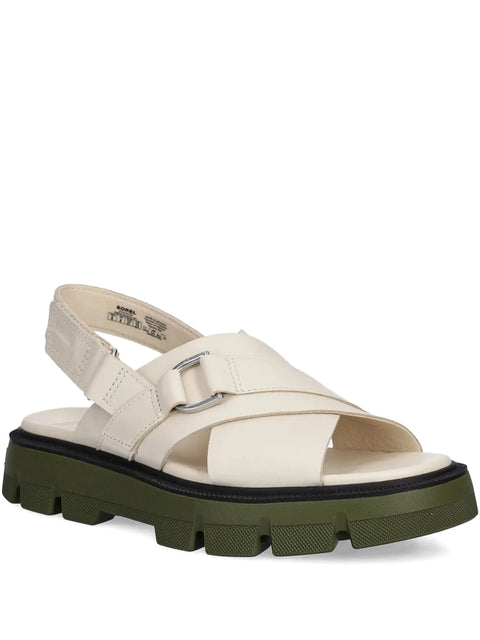 White sandal with green sole on a white background