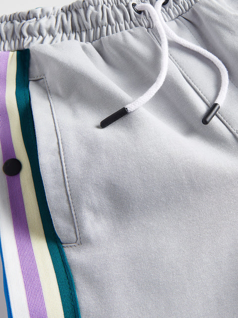 Gray sweatpants with colorful stripes and drawstring detail
