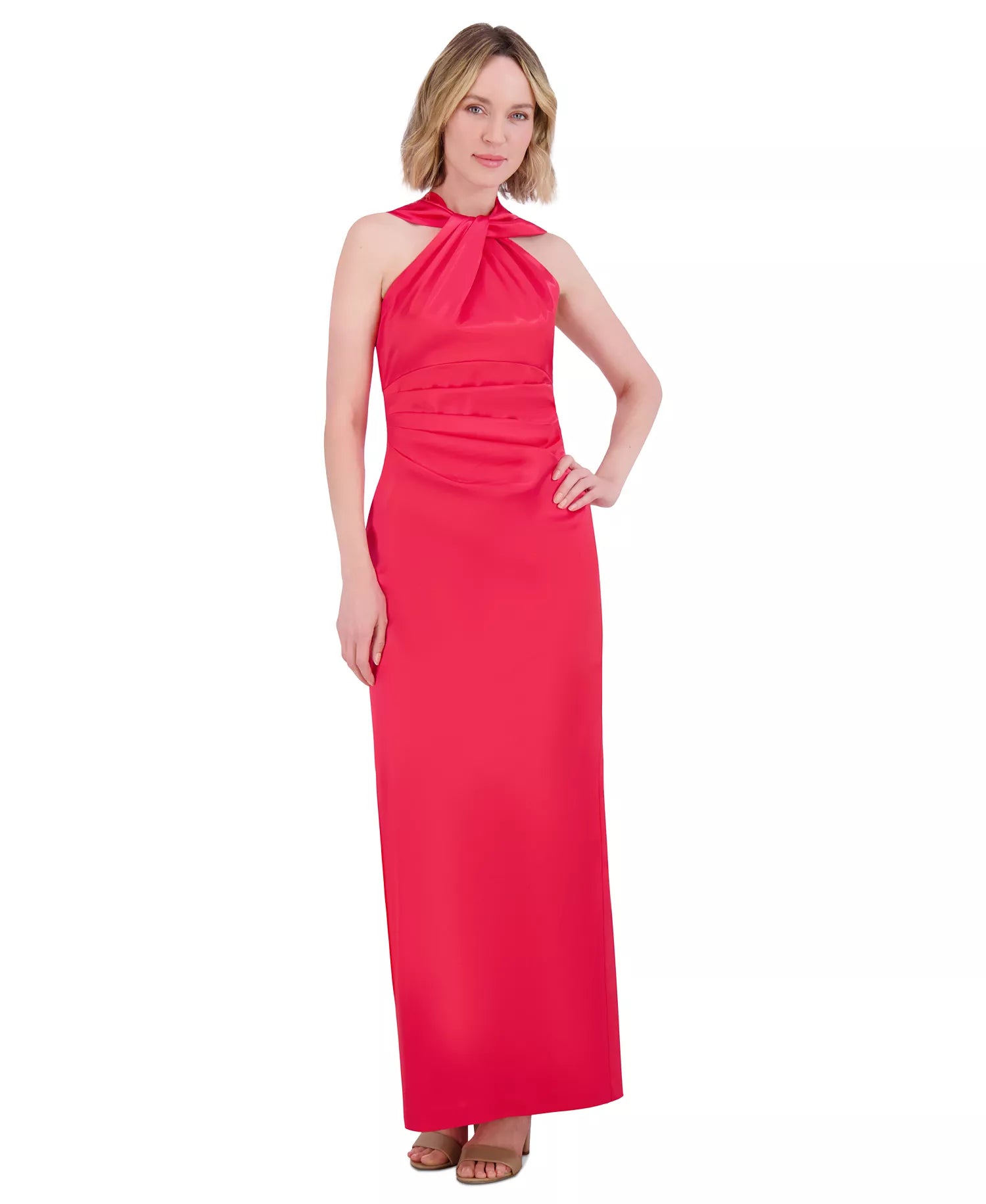 Woman wearing a red halter neck gown on a white background