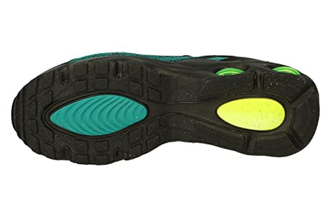 Close-up of a shoe sole with black, teal, and yellow colors on a white background