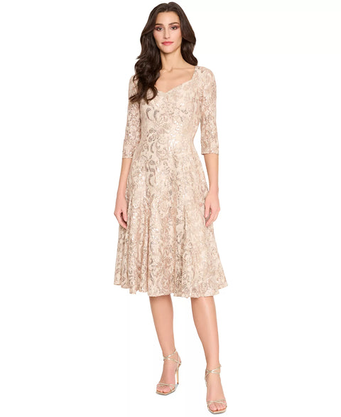 Woman wearing a beige lace dress on a white background