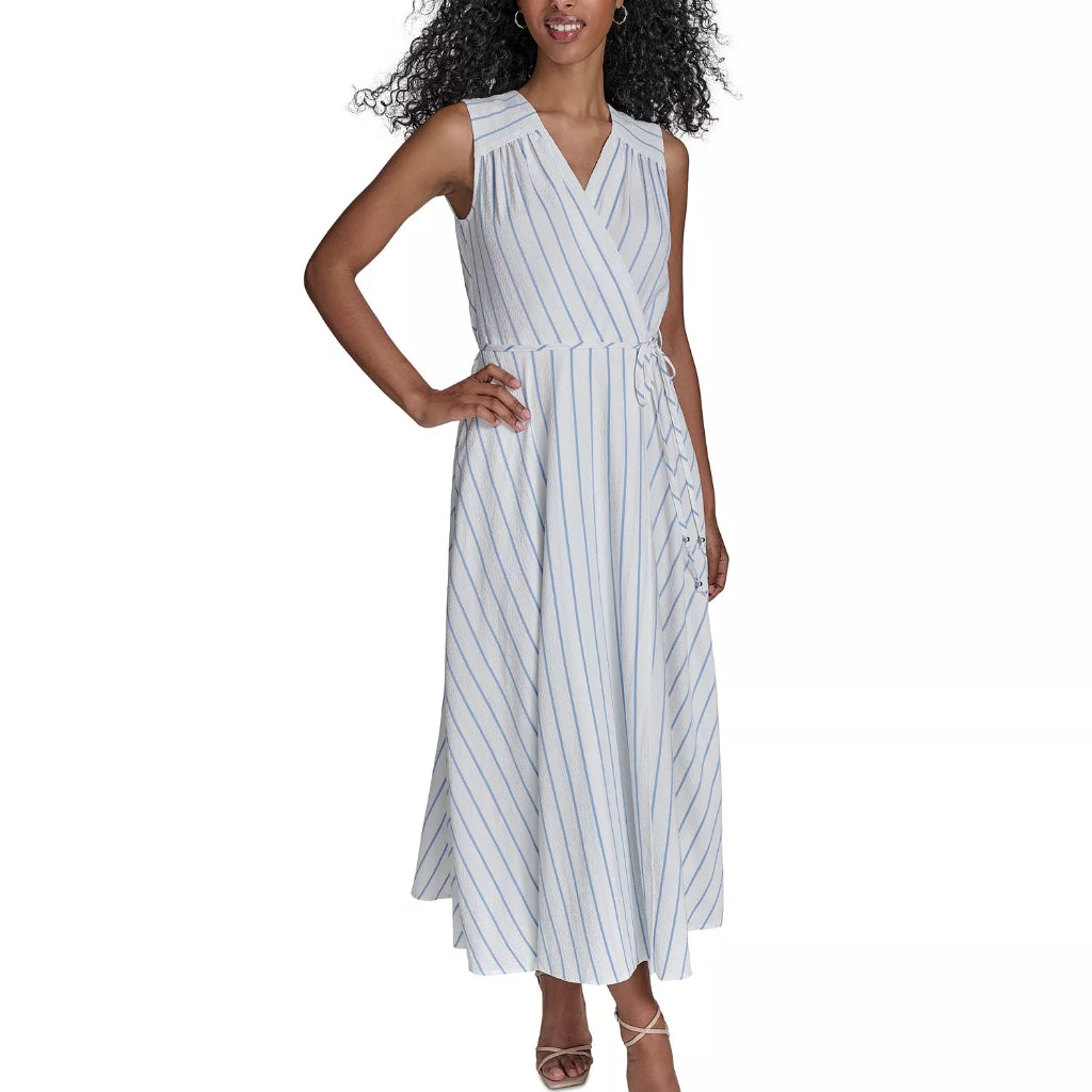 A woman modeling a sleeveless wrap-style maxi dress with vertical pinstripes on a plain white background.