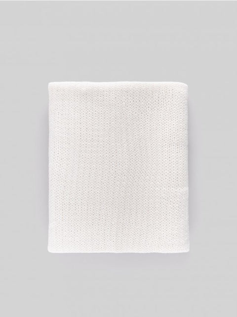 White blanket on a gray background