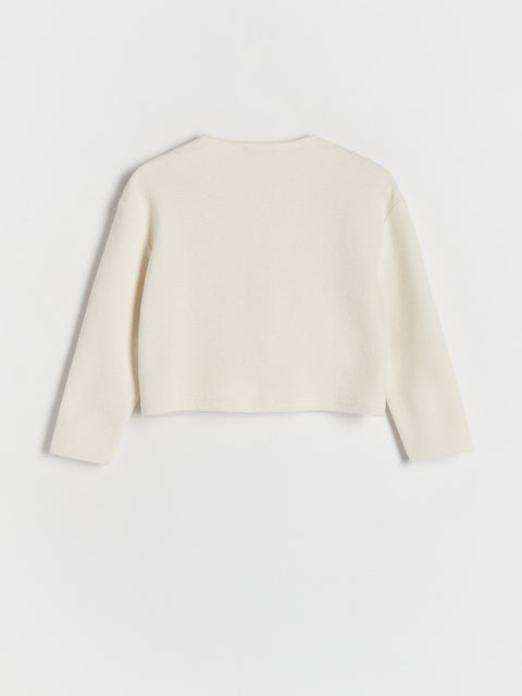 White cropped jacket on a light gray background